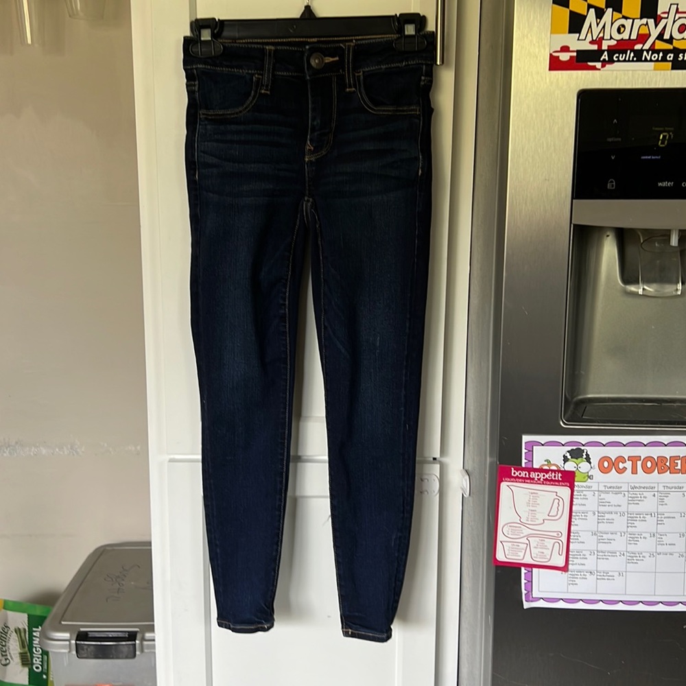00 short American Eagle next level stretch jeggings - low rise dark blue wash